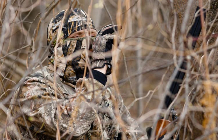 wearing hunting face mask in the field