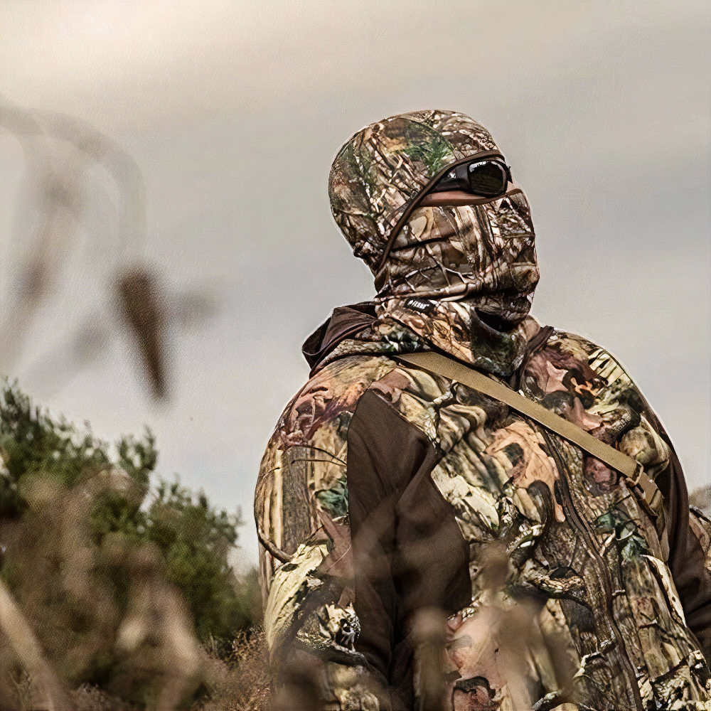 woodland camo pattern hunting face mask in field